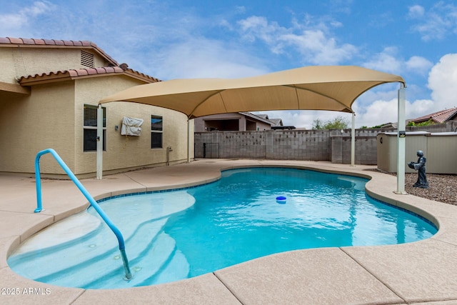 view of swimming pool featuring a fenced in pool, a patio, and a fenced backyard