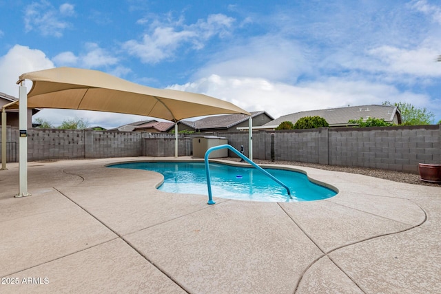 view of swimming pool with a patio, a fenced backyard, and a fenced in pool