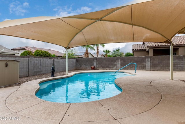 view of swimming pool with a fenced in pool, a patio, and a fenced backyard