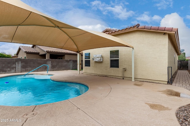 view of swimming pool with a patio area, a fenced in pool, and a fenced backyard