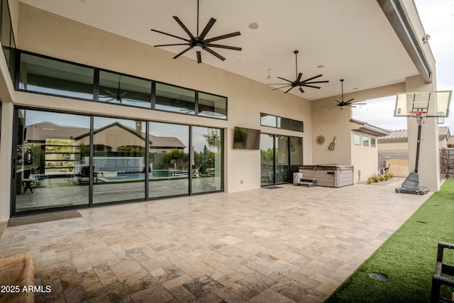 view of patio featuring ceiling fan