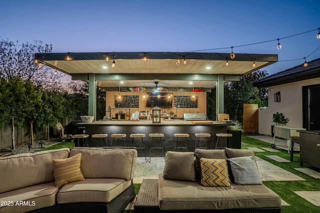 view of patio / terrace with ceiling fan, outdoor lounge area, an outdoor bar, and grilling area