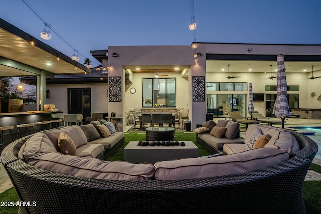 exterior space featuring ceiling fan, outdoor lounge area, and a patio