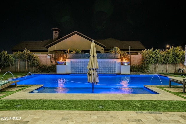 pool at twilight with pool water feature