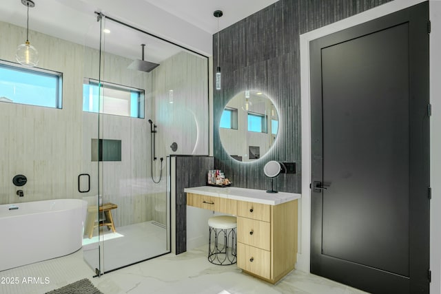 bathroom with vanity and separate shower and tub