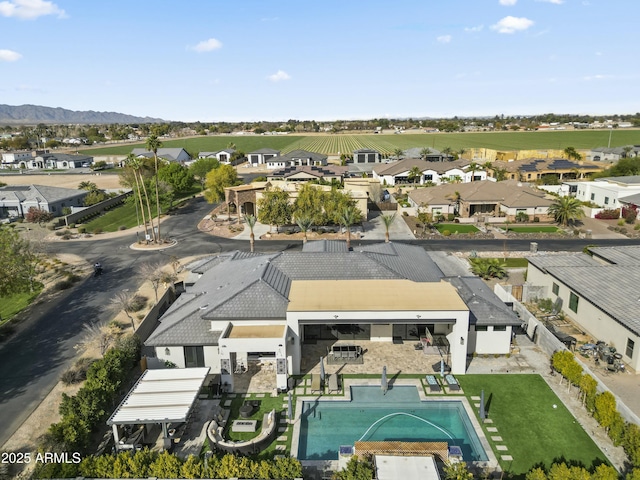 birds eye view of property featuring a mountain view