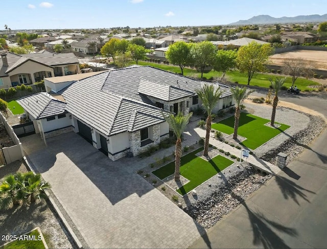 birds eye view of property with a mountain view