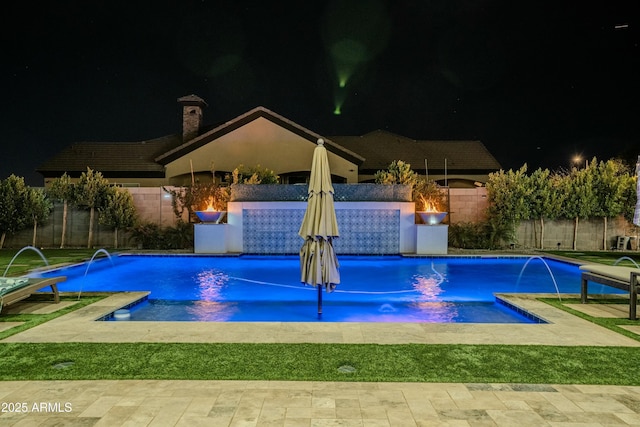 pool at twilight with pool water feature