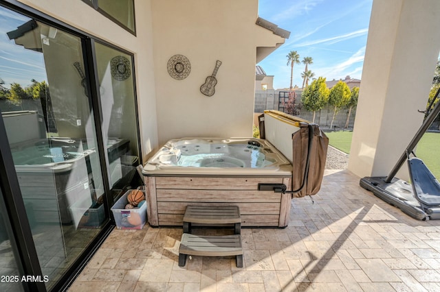 view of patio with a hot tub