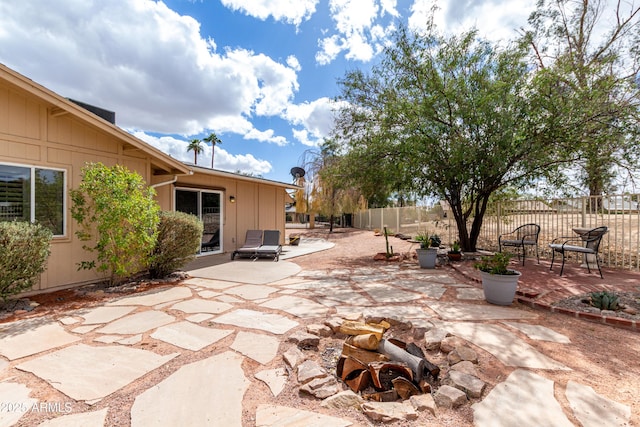 view of patio featuring fence