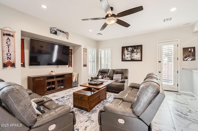 8115 W San Miguel Ave, Glendale, AZ 85303 - living room with ceiling fan, visible vents, a healthy amount of sunlight, and marble finish floor