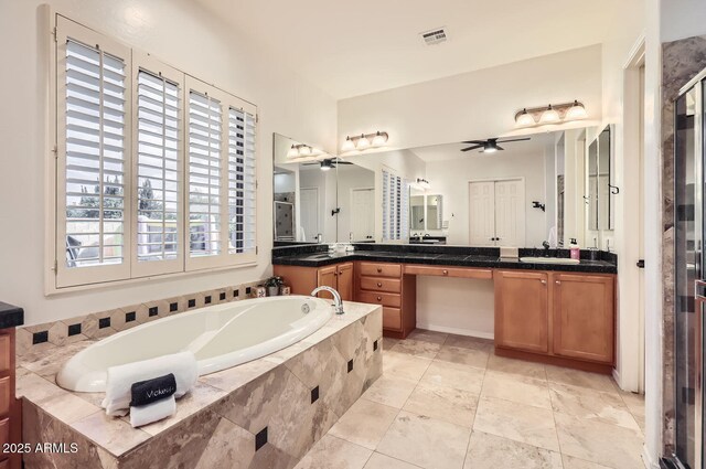 8115 W San Miguel Ave, Glendale, AZ 85303 - bathroom featuring a ceiling fan, a stall shower, a bath, and vanity
