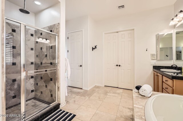 8115 W San Miguel Ave, Glendale, AZ 85303 - full bathroom featuring visible vents, vanity, tile patterned flooring, recessed lighting, and a shower stall