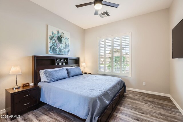 8115 W San Miguel Ave, Glendale, AZ 85303 - bedroom with baseboards, a ceiling fan, dark wood-type flooring, and visible vents