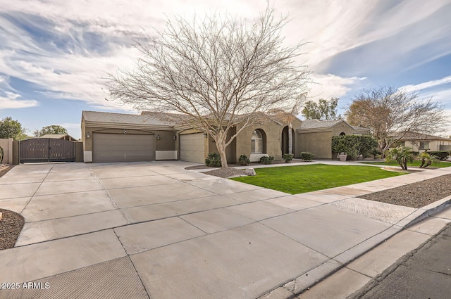 8115 W San Miguel Ave, Glendale, AZ 85303 - view of front facade with a front yard, a gate, concrete driveway, an attached garage, and stucco siding
