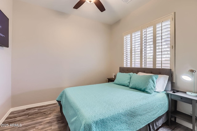 8115 W San Miguel Ave, Glendale, AZ 85303 - bedroom featuring baseboards, a ceiling fan, and wood finished floors