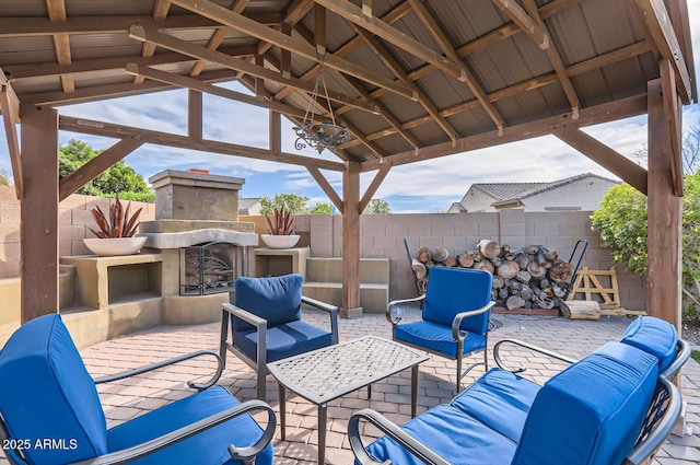 8115 W San Miguel Ave, Glendale, AZ 85303 - view of patio / terrace featuring a fenced backyard, an outdoor living space with a fireplace, and a gazebo