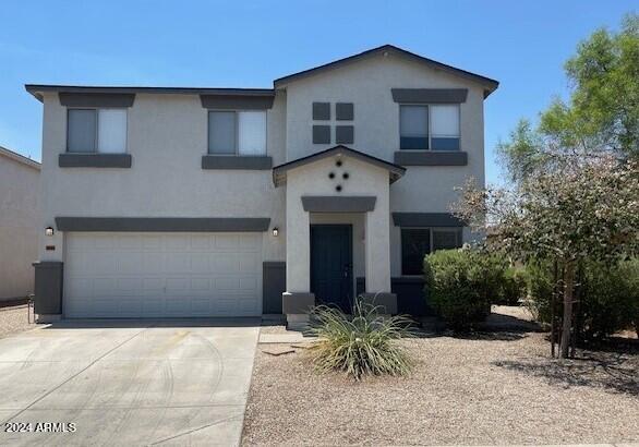 5881 E Sunrise Cir, Florence, AZ 85132 - view of front facade with a garage, concrete driveway, and stucco siding