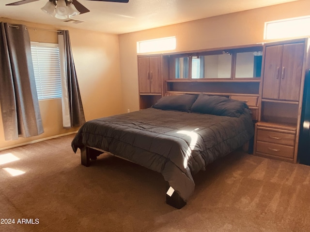 5881 E Sunrise Cir, Florence, AZ 85132 - carpeted bedroom featuring a ceiling fan and visible vents