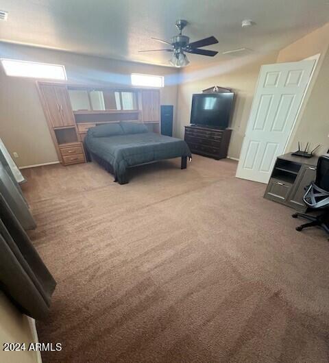 5881 E Sunrise Cir, Florence, AZ 85132 - bedroom featuring carpet flooring, visible vents, and a ceiling fan