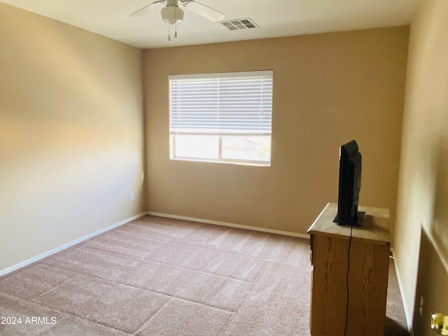 5881 E Sunrise Cir, Florence, AZ 85132 - empty room featuring light carpet, baseboards, visible vents, and ceiling fan