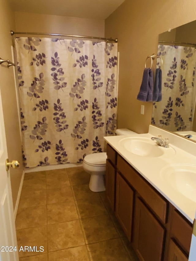 5881 E Sunrise Cir, Florence, AZ 85132 - bathroom with double vanity, toilet, tile patterned flooring, and a sink