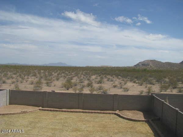 5881 E Sunrise Cir, Florence, AZ 85132 - view of yard featuring a fenced backyard and a mountain view
