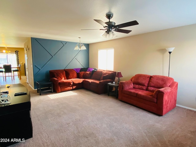 living room featuring ceiling fan, carpet, and plenty of natural light