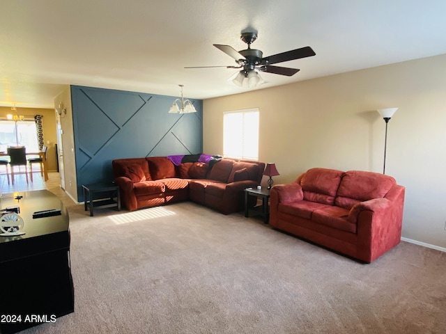 5881 E Sunrise Cir, Florence, AZ 85132 - carpeted living room featuring ceiling fan with notable chandelier and baseboards