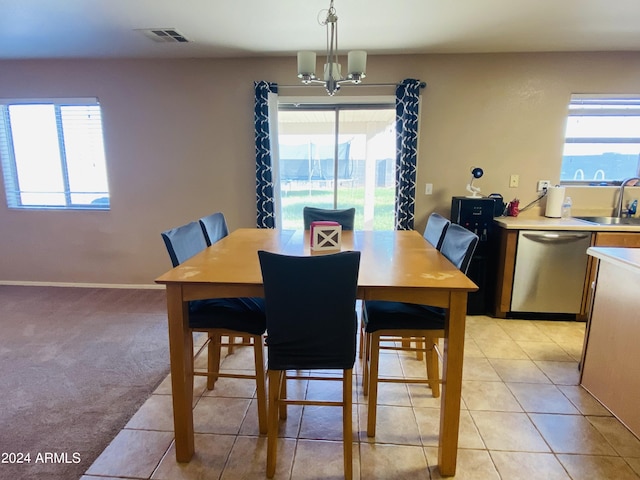 5881 E Sunrise Cir, Florence, AZ 85132 - dining room featuring plenty of natural light, light colored carpet, visible vents, and a chandelier
