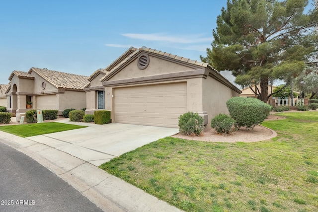 view of front of house featuring stucco siding, an attached garage, concrete driveway, and a front yard