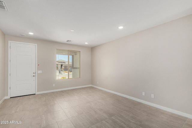 17032 W Cavedale Dr, Surprise, AZ 85387 - spare room with baseboards and recessed lighting