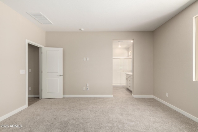 17032 W Cavedale Dr, Surprise, AZ 85387 - empty room featuring light carpet and baseboards