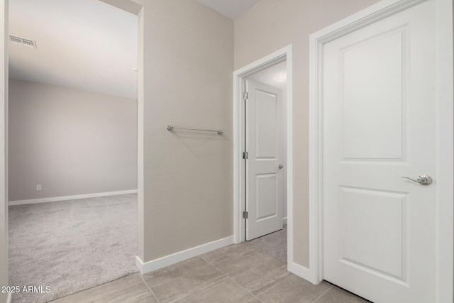 17032 W Cavedale Dr, Surprise, AZ 85387 - hallway with baseboards and light carpet