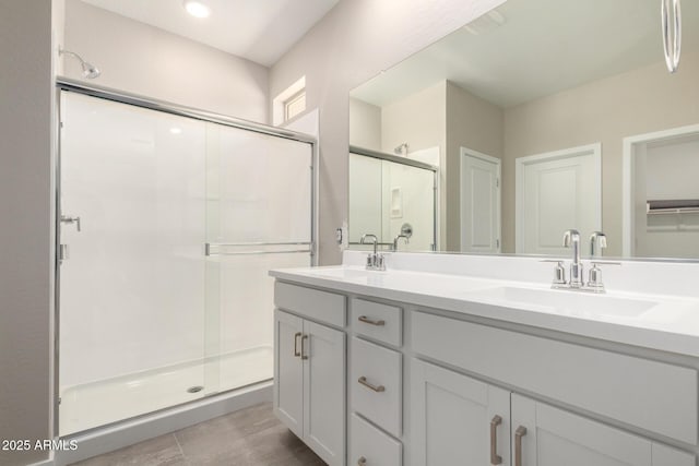 17032 W Cavedale Dr, Surprise, AZ 85387 - bathroom featuring a shower stall, double vanity, and a closet