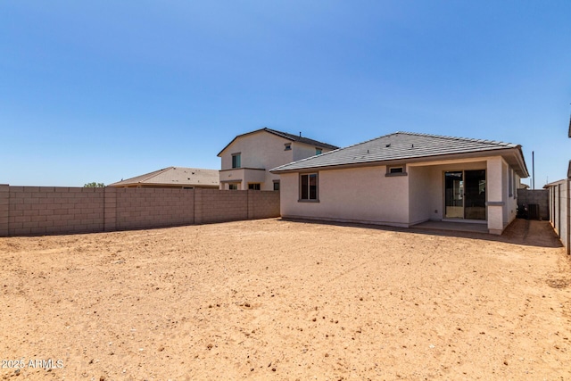 17032 W Cavedale Dr, Surprise, AZ 85387 - rear view of property featuring a fenced backyard, a tile roof, and stucco siding