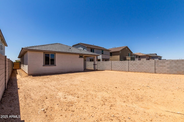 17032 W Cavedale Dr, Surprise, AZ 85387 - rear view of property with a tiled roof and a fenced backyard
