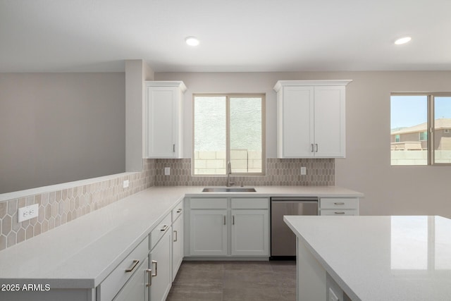 17032 W Cavedale Dr, Surprise, AZ 85387 - kitchen featuring dishwasher, light countertops, white cabinets, plenty of natural light, and recessed lighting