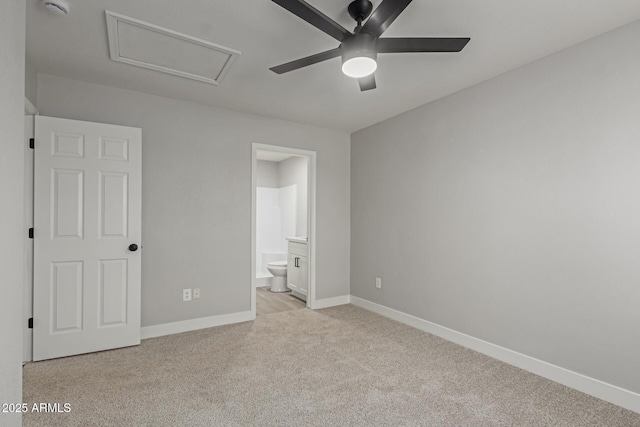 unfurnished bedroom featuring ceiling fan, connected bathroom, and light carpet