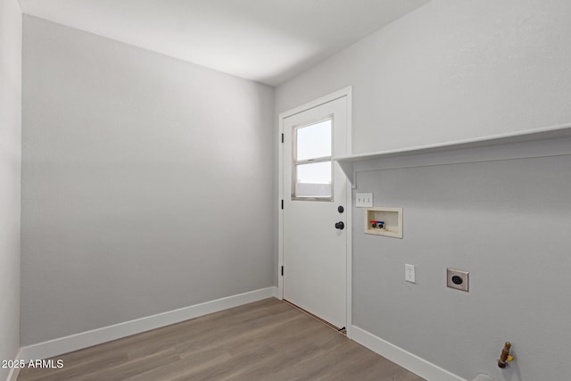 laundry room featuring hookup for an electric dryer, washer hookup, and light hardwood / wood-style floors