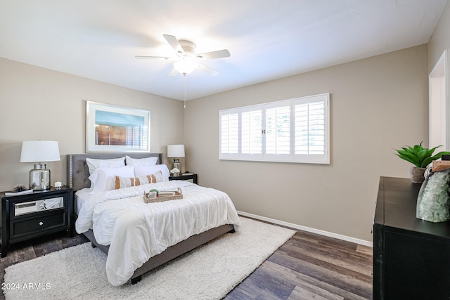 bedroom featuring dark hardwood / wood-style flooring and ceiling fan