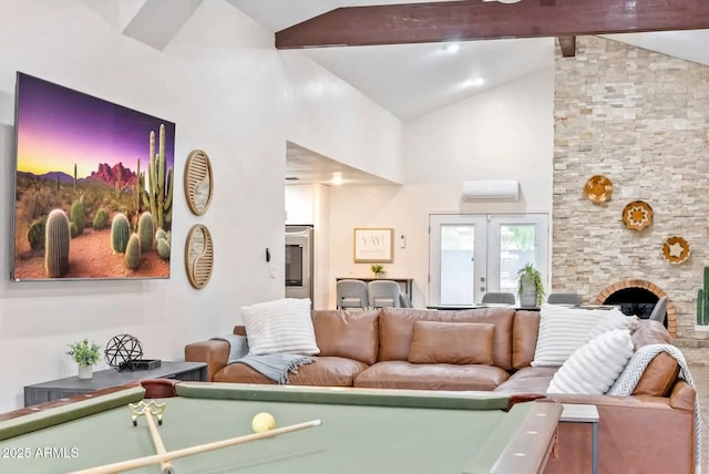 16436 N 64th Pl, Scottsdale, AZ 85254 - living room featuring billiards table, beam ceiling, an AC wall unit, a fireplace, and french doors