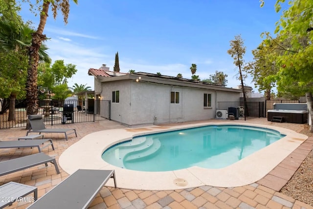 16436 N 64th Pl, Scottsdale, AZ 85254 - view of swimming pool featuring a patio area, a hot tub, a gate, and a fenced backyard