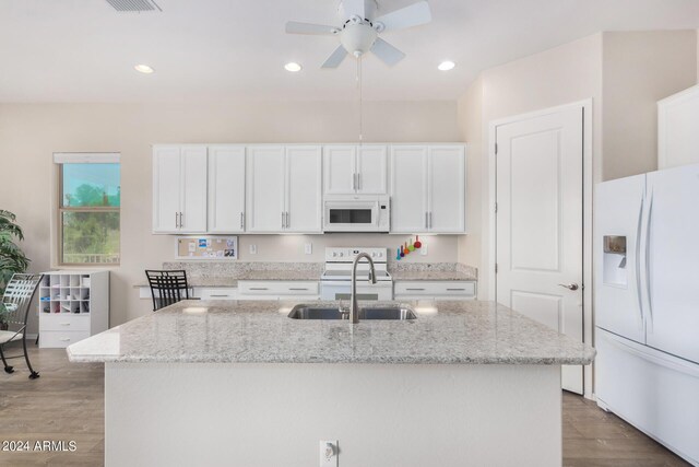 kitchen with white appliances, sink, light wood-type flooring, white cabinetry, and ceiling fan