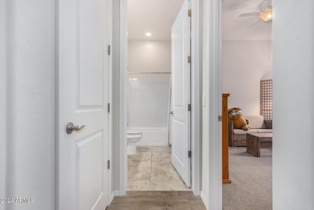 corridor featuring light tile patterned floors