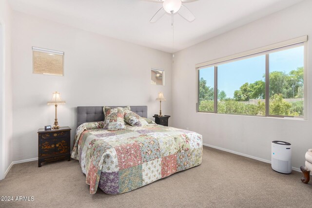 bedroom with light colored carpet and ceiling fan