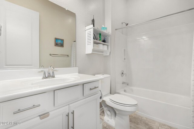 full bathroom with vanity, tile patterned flooring,  shower combination, and toilet