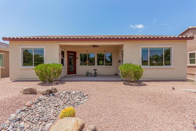 exterior space with a patio and ceiling fan