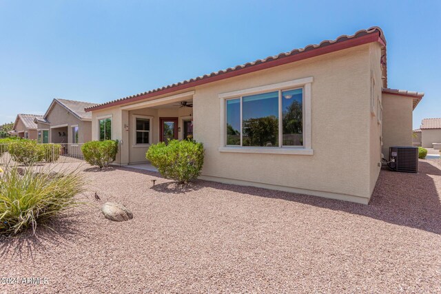 back of property featuring a patio, central AC unit, and ceiling fan