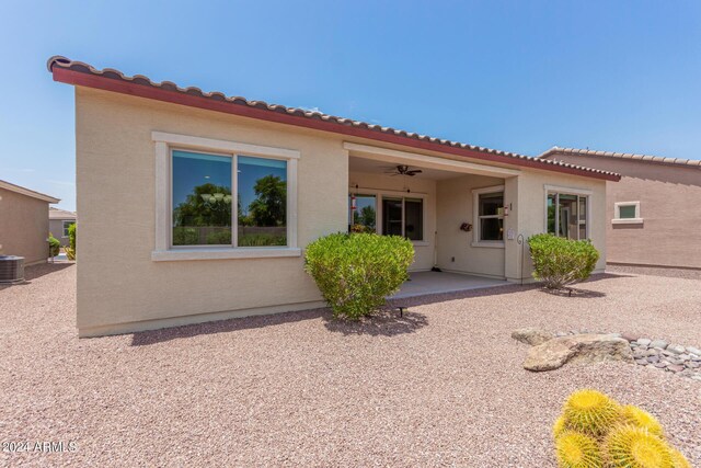 rear view of house featuring a patio, central AC, and ceiling fan